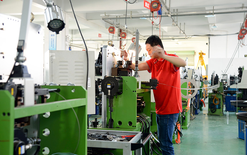Technical staff adjusting equipment
